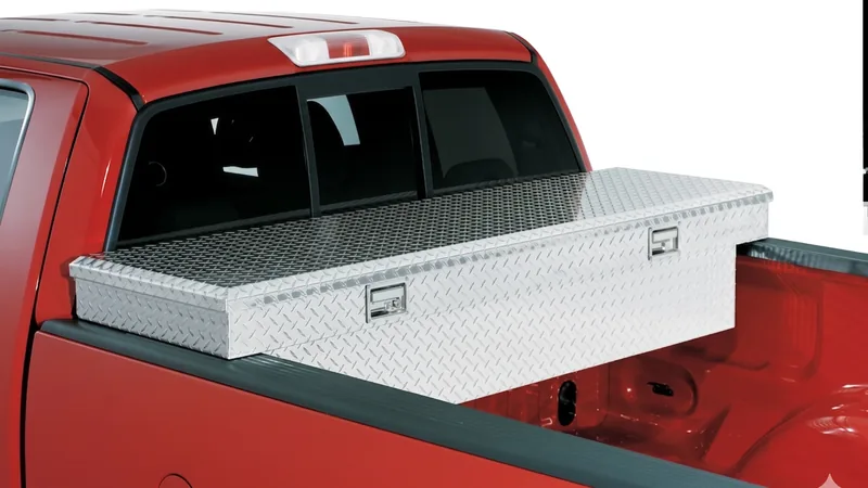 Aluminum truck-bed tool box on a red pickup